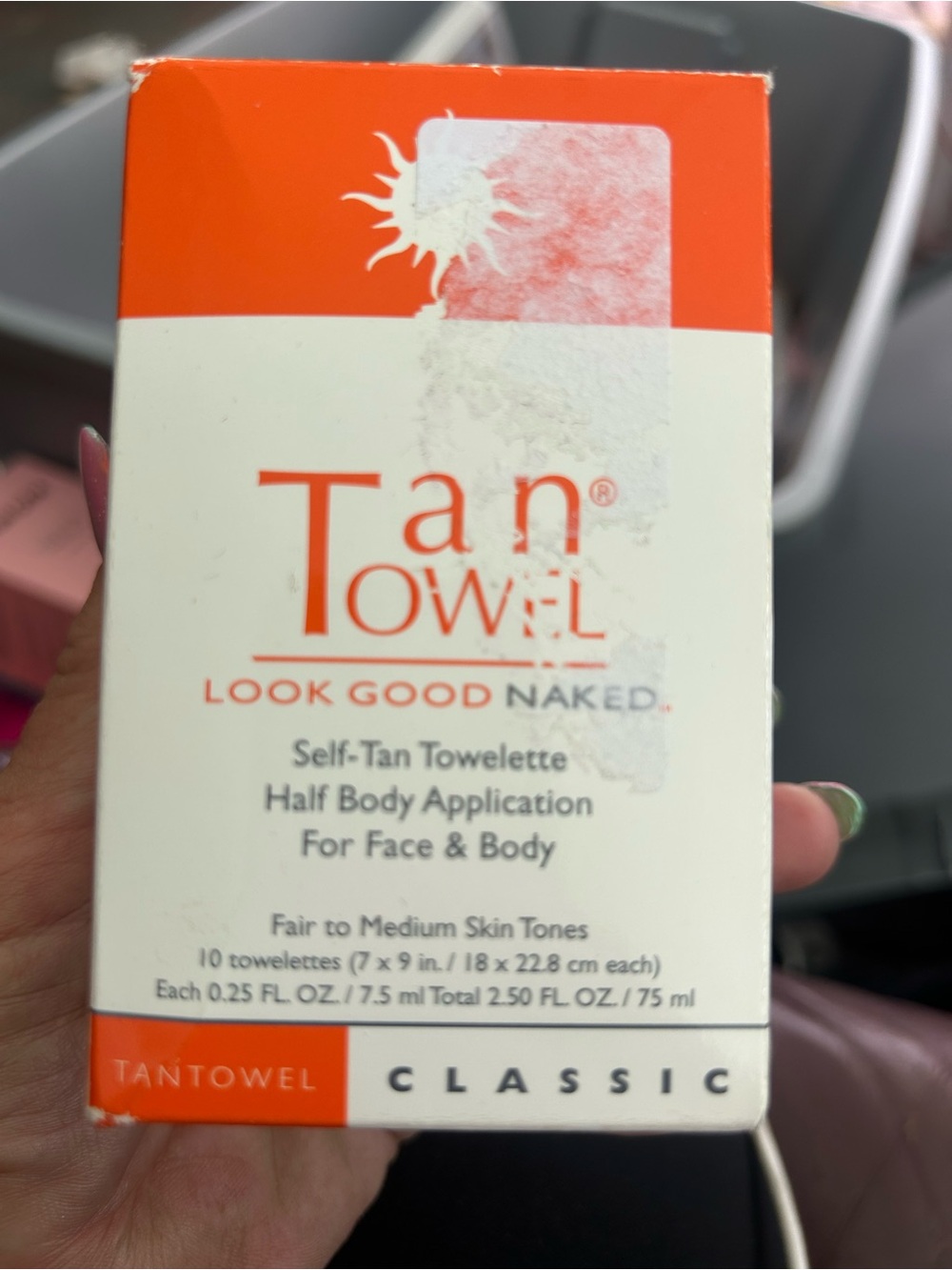 Tan towels. White & Orange Boxed Beauty Product
